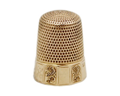 Lot 206 - A USA 14k rose gold thimble by Simon Bros.