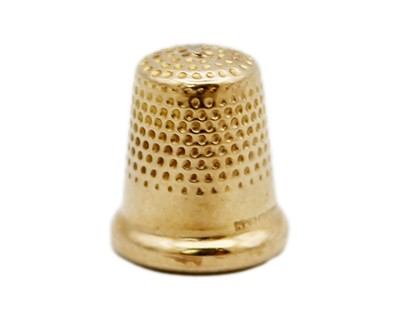 Lot 187 - A tiny 9k hallmarked gold child's thimble by W H Collins & Co.