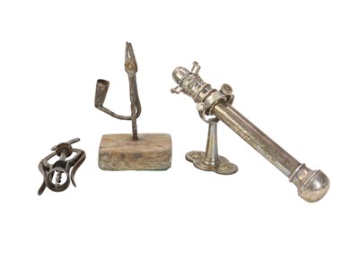 Lot 128 - A wrought iron rush nip.