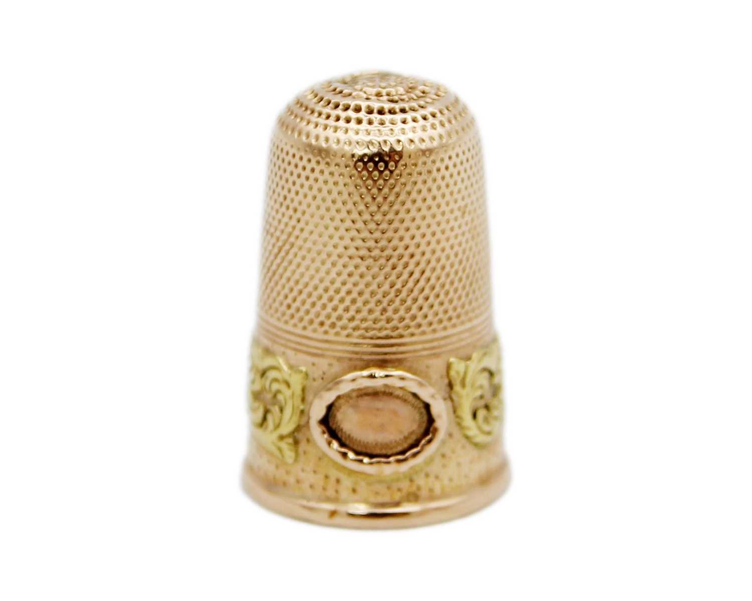 Lot 156 - A 19th century yellow and rose gold thimble.