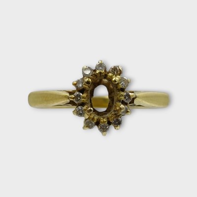 Lot 137 - An 18k gold diamond cluster ring mount.