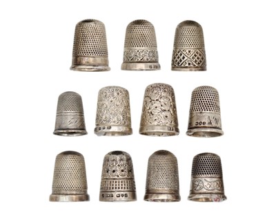 Lot 160 - A selection of eleven silver thimbles.