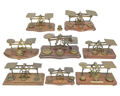 Lot 125 - A collection of post office scales.