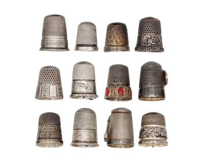 Lot 159 - A selection of twelve silver thimbles.