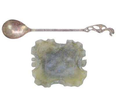 Lot 534 - An Eastern white metal long handled spoon.