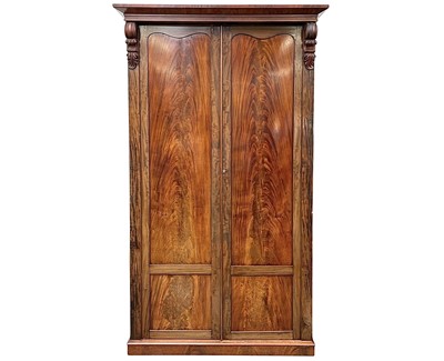 Lot 901 - An early Victorian mahogany double wardrobe.
