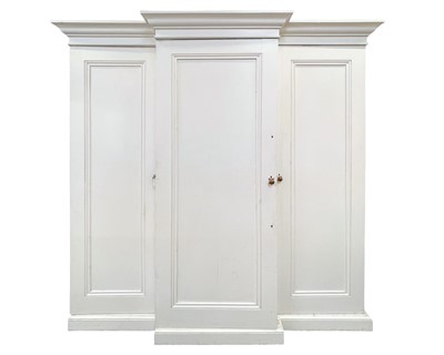 Lot 920 - A late Victorian painted pine breakfront triple wardrobe.