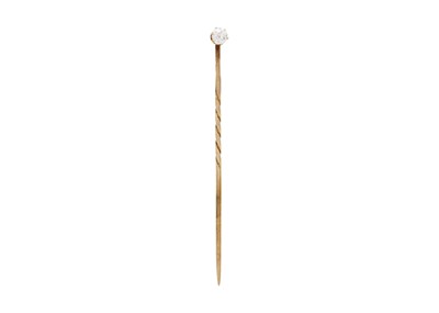 Lot 6 - A yellow gold diamond set pin.