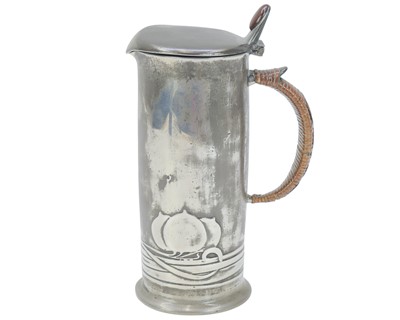 Lot 56 - A Liberty & Co pewter lidded jug.