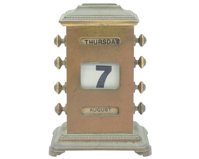 Lot 153 - A brass perpetual calendar.
