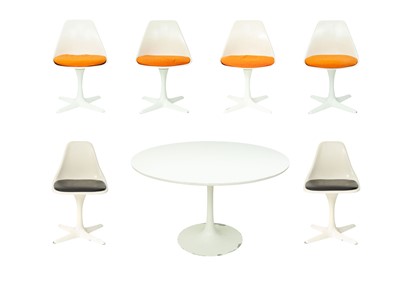 Lot 703 - An Arkana tulip table and six chairs.