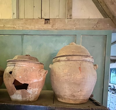 Lot 11 - A large terracotta crock and cover.