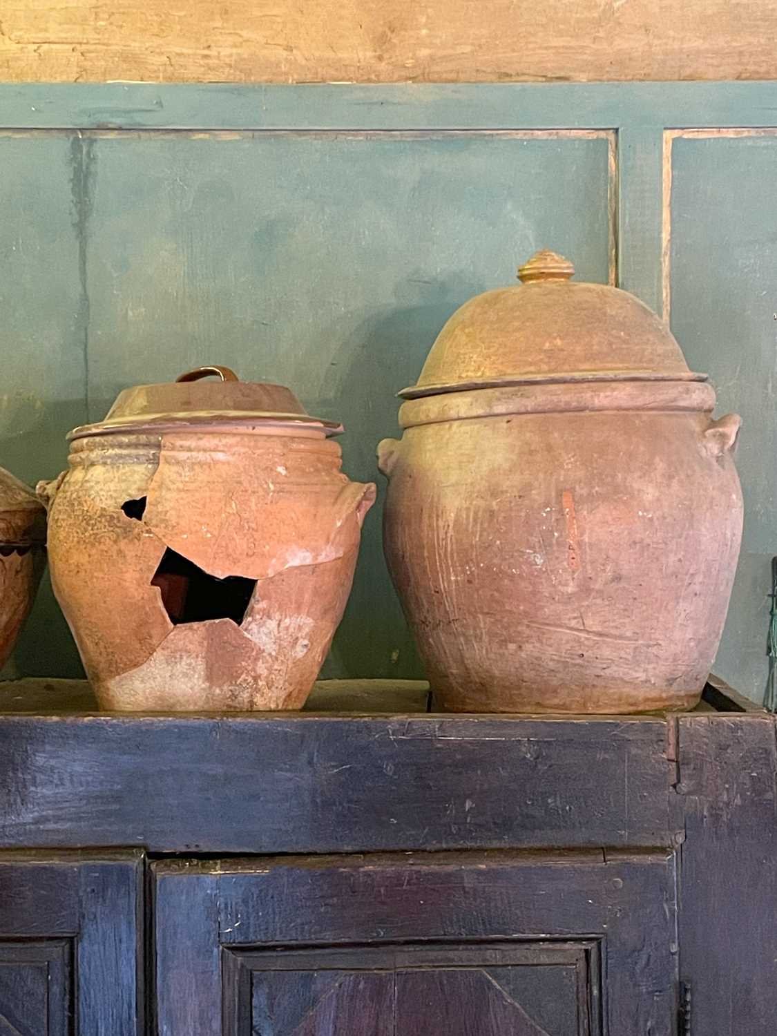 Lot 11 - A large terracotta crock and cover.
