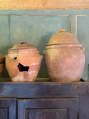 Lot 11 - A large terracotta crock and cover.
