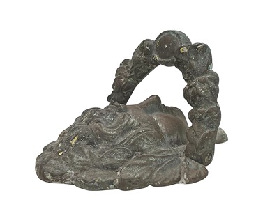 Lot 29 - A brass door knocker.