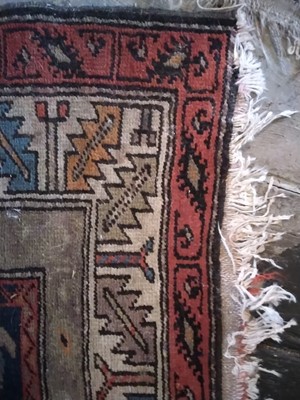 Lot 14 - A Caucasian Rug.