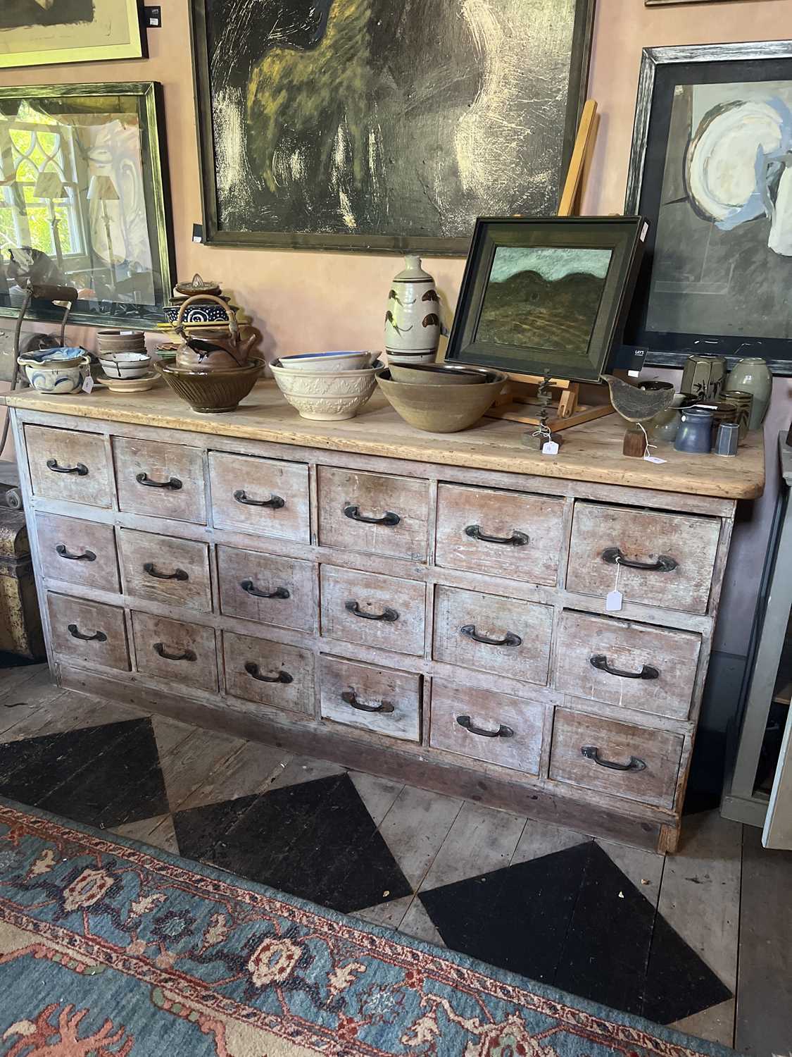 Lot 22 - A substantial Victorian pine shop run of drawers.