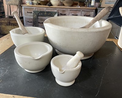 Lot A large white stoneware pestle and mortar.