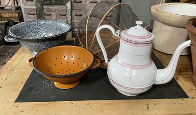Lot 32 - Two enamel collanders.