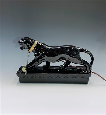 Lot 1045 - A 1950s Lane & Co. black ceramic lamp in the...