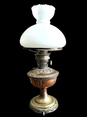Lot 189 - A copper and brass converted oil lamp with a...