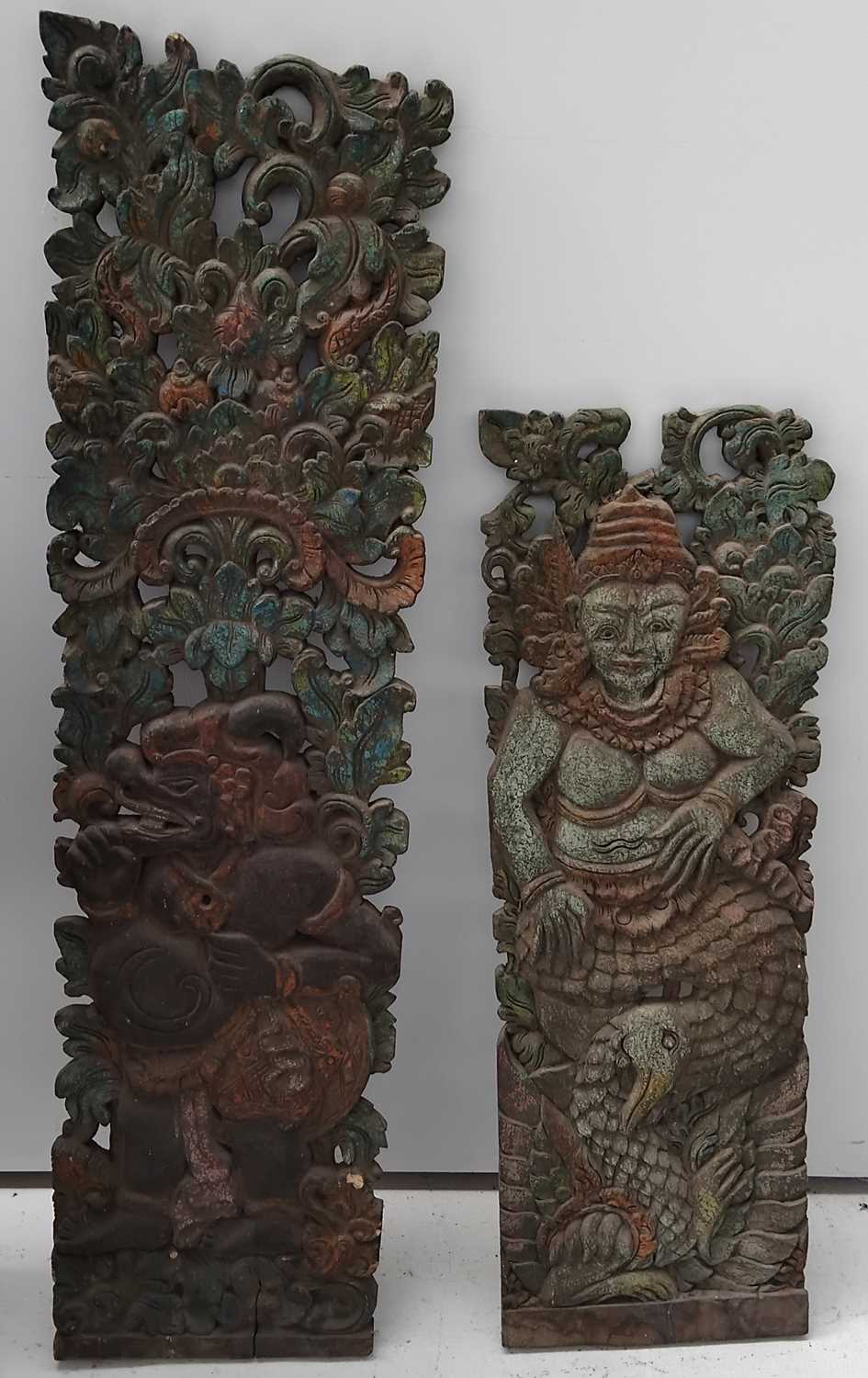 Lot 621 - Two Balinese carved albasia wood architectural relief panels.