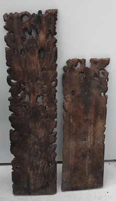 Lot 621 - Two Balinese carved albasia wood architectural relief panels.