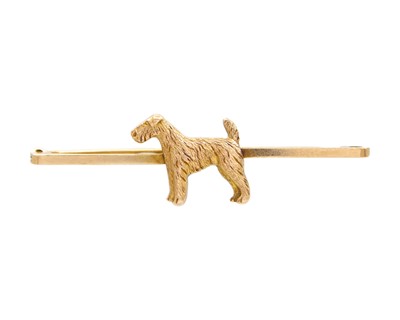 Lot 31 - A late Victorian or Edwardian 9k gold Schnauzer dog bar brooch.