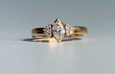 Lot 2467 - An 18ct gold ring set a navette cut diamond of...