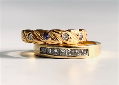 Lot 2468 - Two high purity gold rings each set with...