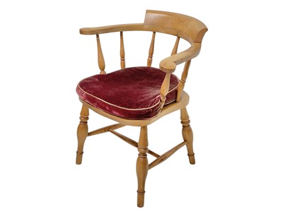Lot 859 - An elm and beech smoker's bow armchair, circa 1900.