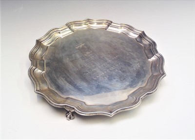 Lot 2031 - A shaped silver tray on three claw feet 18.6oz...