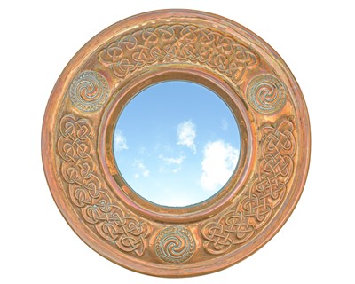 Lot 7 - Francis 'Bert' Cargeeg, a rare hand wrought circular copper wall mirror.