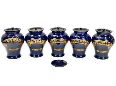 Lot 358 - Tobacciana, a run of five Royal Doulton Bewlay's tobacco jars.