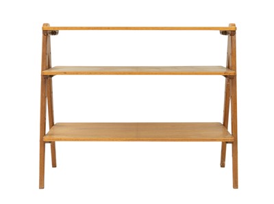 Lot 739 - A Nance Workshop mid century walnut shelving unit.