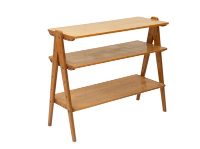 Lot 739 - A Nance Workshop mid century walnut shelving unit.