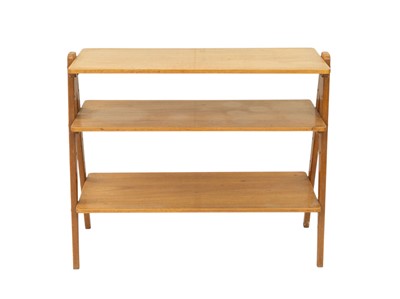 Lot 739 - A Nance Workshop mid century walnut shelving unit.