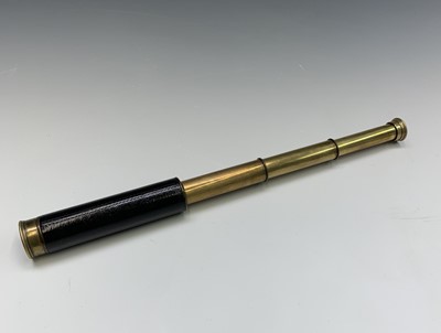 Lot 207 - A three draw brass telescope, with leather...