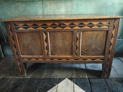 Lot An oak and inlaid three panel coffer.