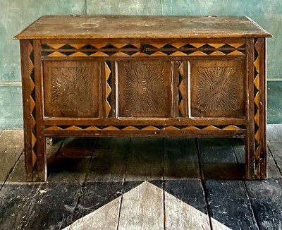 Lot 50 - An oak and inlaid three panel coffer.