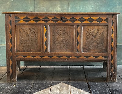 Lot 50 - An oak and inlaid three panel coffer.