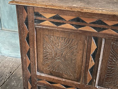 Lot 50 - An oak and inlaid three panel coffer.