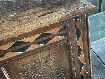 Lot 50 - An oak and inlaid three panel coffer.