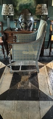 Lot 51 - An Edwardian stained oak armchair.