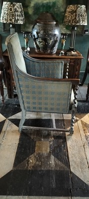 Lot 51 - An Edwardian stained oak armchair.