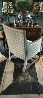 Lot 51 - An Edwardian stained oak armchair.