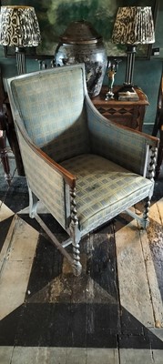 Lot 51 - An Edwardian stained oak armchair.