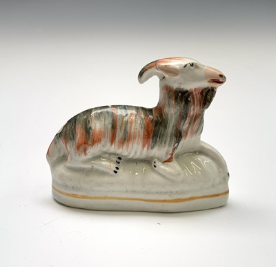 Lot 915 - A 19th century Staffordshire model of a goat....