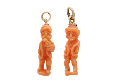 Lot 16 - Two carved coral figural charm pendants on gold fittings.