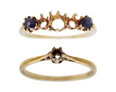 Lot 73 - Two gold rings with missing stones. (one with two sapphires)